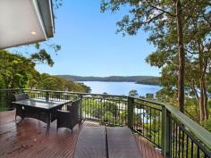 29 Albert Street, Wagstaffe NSW  Set high amongst native bushland, backing onto the Bouddi National Park with breathtaking, north-east facing water views, is this nature lover's retreat. Your stunning views can never be built out from the elevated position that this home provides. Enjoy the sunny north-east aspect from the expansive front deck, with views over the water ways from Killcare to Booker Bay & beyond. Timber floorboards throughout create a natural, rustic charm and the open plan kitchen / living area is flooded with natural light through large windows and sliding doors to the deck. The main bedroom has a walk-in robe, private back balcony and access to the main deck at the front. Downstairs, a large self-contained area provides a 4th bedroom or perfect guest accommodation / home office with separate access. A PJ King inclinator transports you to the upper level and all just a five minute walk to the Wagstaffe store, community hall and the Palm Beach ferry wharf. 