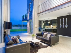 Tailored for luxury living, this cutting edge, sub-station style residence delivers a flawless combination of style and comfort on an 810m2 allotment. Expertly designed and built by Tustin Constructions, this home is lavish and sophisticated, yet thoroughly effortless throughout all 5 levels and easily outshines its peers in presence and position.

A seriously stylish industrial interior opens up to a spectacular open plan layout to reveal dramatic design elements incorporating high specification finishes including honed concrete floors with heating, polished white set concrete walls, remarkable clay bricks sourced from period buildings in Sydney and age from 80 to 90 years old, 2 automatic Monarch vertical stacking bi-fold doors creating a seamless flow between inside and out.

A gourmet kitchen incorporates a striking combination of stainless steel bench tops, dramatic black cabinetry and is complemented by an array of quality appliances and walk-in pantry. The kitchen flows out to the poolside terrace, complete with built-in BBQ making this area superb for entertaining guests. The 2m deep pool has provisions for solar heating if desired. Why not step it up a notch and guide your guests up the spiral staircase to the roof top deck, where an absolutely mind-blowing 360?? view awaits that will undoubtedly impress.

The second level finds the presidential master retreat, which is immense in size and unreservedly opulent. Boasting a custom-built walk-in robe and a glamorous ensuite that offers a relaxed ambience and is complete with heated flooring. Additional bedrooms on this level both offer built-ins, air-conditioning and ceiling fans, and share a designer bathroom also with heated floors and separate bathtub.

The lower level affords versatility for family and guests alike by providing a hotel style suite, making this room a perfect teen retreat or perhaps cater for an Au pair. An additional room within the garage could quite possibly be a textbook man cave, however, as it is complete with an ensuite it gives you the option to use as a fifth bedroom if desired.

This immaculate home focuses on quality and comfort with no expense spared. Comprehensively appointed with extras including Synergy glass windows and doors, Grey Iron Bark floors, 6 car garage, additional 2 undercover car spaces and prestige fittings and fixtures throughout.

Crafted with exceptional vision and passion, this property is nothing short of breathtaking!