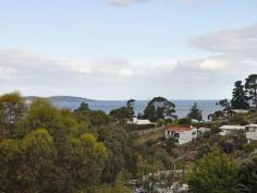 24 Mirramar Park, Blackmans Bay TAS Enjoy the Water Views from the Balcony This is a neat and tidy 3 bedroom home which anyone should be proud to own or invest in as this has been well maintained and cared for by the owners. Of course the view was always the main attraction and the large rear balcony takes advantage of this and is easily set up for a BBQ with table and chairs or a sun lounge. This overlooks the rear garden, with a few fruit trees, also a feature of the front yard. With two of the three bedrooms being doubles with built in robes and the use of timber venetian blinds and shutters across the balcony doors, this home will delight those desiring a simple home with water views, tranquillity and privacy. The interior has been nicely decorated with owners choice paint, specialised light fittings all with the comfort of a wall mounted electric Pureheat heater (lounge).  Additional garden and general maintenance storage has been utilised with the enclosing of the underside of the rear deck allowing easy access to the yard and trailer deliveries. The rear garden/lawn area is full fenced and secure with sensor spot lights servicing the front and rear areas. Driveway and parking facilities have the advantage of being available at the front and rear entries with gate access also being through the rear/side boundary fence.  House size 110 sqm (approx) Land sizw 692 sqm (approx)   Property Snapshot   Property Type: House Aspect Views: Water and Valley views Construction: Brick Veneer Features: Balcony Built-In-Robes Close to schools Close to Transport Dining Room Electric Heating Established Gardens Fenced Back Yard Lounge Security Screens Storage Waterview 