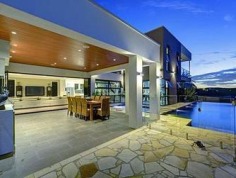 Sprawling Family Estate
Privately tucked away on a sensational block, this massive family home has everything a modern family needs and more. Open plan living and free flowing light filled spaces present the ideal design for everyday living. This whisper quiet location with views brings a whole new meaning to privacy.

At the very heart of the home is the chefs kitchen with Gaggenau appliances including self-cleaning oven, steam oven and coffee machine, stone bench tops, butler's pantry with sink and 2 fridges, plenty of storage and a breakfast bar that flows seamlessly through to the dining and living areas. Leading out through bi fold doors from main living space is the expansive outdoor entertainment area, highlighting 2 fridges and a sink, perfect for every season, taking in the spectacular view over the resort style, negative edge solar heated pool, spa and Balinese inspired setting and swim up bar.

The home holds five bedrooms, all include built in robes and the main bedroom includes a luxury ensuite, walk-in robe and private balcony overlooking the entire grounds. All bedrooms enjoy the views of the estate and its leafy surrounds. A well-appointed main bathroom also services the bedrooms on the upper level.

The entire home is air conditioned throughout and incorporates an intercom system for added security. The family has catered for the kids with a play area featuring bubbles and squirts. Outside the grounds are complete with chicken coop, dog area with gate enclosures and a citrus garden. With 9 car under cover accommodation and another three bay shed, incorporating high boat/caravan port, this private family home is ready for you to simply move in and enjoy.

This captivating residence is just moments from Westfield Carindale, close to local shops, elite schools, and enjoys easy access to main arterial roads. Relax and take in the views at your new Place.