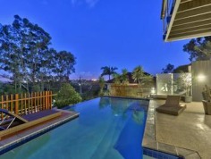 Distinctive Executive Design offering enviable lifestyle
Designed by Brisbane renowned architects Arkhefield, the residence rises from the street to a commanding position on 810m2 - a statement in engineered executive architecture and design. The angular vertical and horizontal planes, innovative utilization of glass sliders and bi-folds has created a residence that flows seamlessly inside to outside and from formal to informal living. Spanning three levels the home captures views overlooking Bardon to Brisbane city, as well as the gentle north-easterly breezes. Distinctive and unique, it is a residence that accommodates the growing family to perfection.

Entry
* Formal living and dining is elevated on a spotted gum timber floor and spills out onto the covered verandah perfect for entertaining
* Gourmet Galley style kitchen featuring Corian bench tops, sleek cabinetry and stainless steel appliances
* Open plan family living and dining flows out to a private patio 
* Three generous bedrooms, with built-in robes and ceiling fans
* Study that shares the patio
* Fitted laundry 
* Family bathroom and Powder room

Ascending the central suspended staircase
* Parents retreat with stylish ensuite featuring spa bath and twin basins
* Generous walk-in wardrobe
* Glorious views to the city and surrounds

Descending the central suspended staircase from the entry level
* Glorious undercover alfresco living overlooks the infinity edge in-ground pool and beyond
* Media /Rumpus room 
* 3rd bathroom
* Triple lock-up garage with generous storage space

Outstanding features
* Architectural innovation and style
* Combination of spotted timber floors, tiles and carpeted bedrooms
* Ceiling fans in bedrooms and ducted air-conditioning throughout
* Stylish attention to detail and finish

Positioned in a tightly held pocket amongst prestigious residences this home offers an enviable lifestyle that supports your executive needs. Located close to schools, parks and local shops with the Paddington and Rosalie cafe precinct, and City are on your doorstep.

For more information please call Andrew Degn 