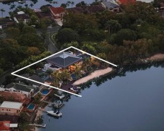 An exceptional and private landmark property of world class standing centrally located on the Gold Coast. Custom built architectural excellence to rival the best homes on planet earth, this iconic prestige riverfront estate on Adam’s Basin encompasses a perfect north east aspect on 2,197sqm land amid exotic gardens.
Exquisite north east aspect formal and casual living spaces
Selected timbers, hand cut sandstone and Travertine floors
Lanai entertaining area overlooks a sparkling pool and spa
Granite Euro equipped kitchen, butler’s pantry and cold room
King sized bedrooms with ensuites, main has a dressing room
Impressive rooms and private wings include a billiards den
Theatre, study, gym, Lanai bar and BBQ kitchen; maid’s quarters
Temperature controlled vast wine cellar; sauna and heated spa
Lift, Lutron wiring, CCTV and basement parking for six cars