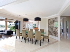 This prestigious estate is situated at the end of the highly respected Maryland Avenue. Situated in privacy behind grand electric gates and sand stone walls are two prime acres on two titles.

The architect has designed this home to maximize its North facing position with views to the East as well. This park like setting with mature trees is elevated 1.7 meters above adjoining land and has not been affected by major floods. This recently refurbished residence offers 1,000 square meters of opulent decor with the latest sinks, tubs and tap ware. Separate from the main house and situated near the entry gates is 2 bedroom guest house with its own complete kitchen, laundry, lounge and study. A large pontoon and wharf beside the river gives access to the Broadwater and out to the ocean from your back yard.

Features of this property:

7 Bedrooms, 6 bathrooms, 5 car garage with parking for upto 10 vehicles
Master bedroom includes parents retreat, twin dressing room, riverside balcony, and deluxe ensuite
Designer chefs kitchen with granite bench tops, 2 oven plus warming ovens, and walk in pantry
A Helipad has been approved for this estate.
Championship tennis court with flood lights and pavilion with kitchen, bath and shower.
10 meter pontoon, jet ski cradle, power and water supply
Infar-red security cameras with back to base alarms
Automatic emergency power generator
fully automated irrigation
Future sub- division potential - subject to council approval
Formal living area with open fireplace
Wine cellar
indoor/outdoor entertaining
In-ground swimming pool
in home theatre with elevated seating and soundproof walls
Games room
sizable laundry
Ducted air-conditioning
Landscaped gardens with mature trees and lush lawns, Horses are permitted on the property
Sweeping 200 degree river and skyline views
Less than 5 minutes drive to Royal Pines Golf Resort, Emerald lakes golf, Lakelands golf
8 min drive to Major Shopping Centres, Schools and Central Business district
This property is currently on two titles with an option to purchase the main house and guest house on 1 acre, or purchase 1 acre of riverfront land for offers over $2 million
