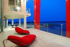 Magnificent is truly an understatement. The epitome of contemporary style and supreme luxury, this superb abode caters for your every need. With over 2,200 square metres of opulent living, the sprawling home is spread over 4 levels. Characterised by floor-to-ceiling glass, superlative black granite tiles, vibrant red features and exquisite furnishings, this mansion is built for living on a grand scale.

Positioned in a premium street in the exclusive Sovereign Islands, this spectacular residence boasts an awesome street presence. On the water side, you will enjoy a protected position in calm water, while looking directly over the Broadwater and out to South Stradbroke Island and Surfers Paradise - a rare and privileged position.

It's features include:

- 60 metres water frontage (approx)
- 18 metre floating pontoon
- 9 metre high entrance foyer with imported chandelier
- 7 massive bedrooms, all ensuited with walk-in robes
- Incredible master suite
- Kids retreat with rumpus lounge, 2 bedrooms and study/storage room
- Separate fully self-contained caretaker's apartment
- 2 executive offices with luxury built-in storage rooms
- Games room with fabulous views
- Media room with built-in bar
- Multiple lounge and dining areas
- Sensational full-size bar
- Stunning temperature-controlled 1500 bottle wine cellar with wine-tasting bar
- Fabulous enormous kitchen with the ultimate in appliances and butler's pantry
- Multiple outdoor entertaining areas
- Full outdoor kitchen and 2 x built-in BBQ's
- Indoor heated pool and separate spa
- Fully equipped gymnasium
- Breathtaking 6000 litre tropical aquarium feature
- Commercial 12-person lift servicing all 4 levels
- Basement garaging for 15 cars
- Manicured gardens
- AMX automation system
- Full concrete construction

Only an inspection can truly reveal the magnificence of this incredible home. Call agent now to arrange your private inspection - confidentiality assured.