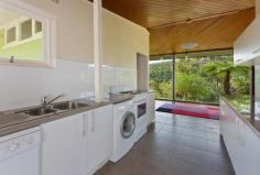  54 baggage road, roseville chas nsw contemporary cottage, extensive land, water views impressive opportunity to build your masterpiece or enhance the existing pavilion style residence (stca) to take full advantage of this blissful location boasting approximately 1328sqm of land overlooking spectacular middle harbour and garigal national park. lovely circa 1960s contemporary residence with an open plan layout integrated living and dining with impressive floor to ceiling wraparound windows embracing the views, indoor/outdoor flow to patio and garden open plan modern kitchen with sleek white cabinets and neutral bench tops, electric range, intergrated laundry with outdoor flow to 2nd patio two light-filled bedrooms, master with generous built in robes original full bathroom with separate bath and shower north to rear aspect gently descending block with masses of useable land and extensive level lawns, mature gardens with citrus trees and sandstone accents carport with covered access, additional parking on drive, reverse cycle split system air conditioning quiet and tranquil location with a leisurely stroll to echo point park and marina  short walk to major bus routes, set in killarney heights high school catchment disclaimer: all information contained herein is gathered from sources we believe reliable. we have no reason to doubt its accuracy, however we cannot guarantee it. you must rely upon your own inquiries as to its accuracy or otherwise. 