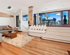 ‘Villa Gabrielle’ graces an address reserved for a privileged few with three architect designed levels embracing sweeping ocean views to Mount Warning. This property has a series of customised living and entertaining spaces and is footsteps to the beach.
Glass doors open to reveal the best views in Byron Bay
Double height foyer has an aquarium and Italian marble floor
Split level dining area and Miele equipped designer kitchen
Lounge features blackbutt floors with a red mahogany border
Tropical gardens reveal a stone water cascade and log gazebo
Black tiled 12m swimming pool with a Japanese stone wall
Double bedrooms pair with deluxe, bespoke feature bathrooms
Master enjoys a level of luxury and a sea view bath ensuite
Vast 734sqm block with lane access and stairs to beach
Near conservation area and minutes to the heart of Byron Bay