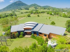 Over the years there is only a handful of areas in the Noosa Hinterland that fall in the category of "rolls royce" addresses. Lonehand road is definitely one of those roads /locations. Understandably so with features such as quiet country lane, gentle fertile exdairy country, good quality underground water, and perfect northerly aspect to Cooroy Mountain and surrounded by good quality well maintained properties. Conveniently located five minutes to the market town of Eumundi or five minutes to thriving Cooroy, the hub of the Noosa Hinterland. Noosa and all it has to offer including beaches, restaurants and boutique shopping is approximately 20 minutes easy drive. This beautiful, fertile north facing 17.95 acre property was selected by the current owners in 1999 and the construction of the residence was completed in 2000. Definitely not your average brick & tile, the contemporary boomerang design residence was created to focus on the elevated northerly view over the gentle pastures through to Cooroy Mountain. The central area of the home incorporates the front entry deck, open plan living including dining, kitchen and under cover north facing deck area. The western wing comprises of the master suite with open deck, whilst the eastern wing includes 3 bedrooms, main bathroom, laundry and timber floor double lock up garage. 

A few of the features of the residence include blackbutt timber hardwood floors ,high curved metal custom orb ceiling in living area, insulated ceilings external & internal walls, dual system ducted airconditioning,vacum maid system and surround sound. 

The shed/workshop is not your average shed either. Approximately 108m2 shed/workshop with2 x 2.9 m high remote doors,s/steel washup sink and tiled bathroom with shower,vanity& toilet.But that's not all,the side annexure incorporates a 20m2 aircondiioned office with built-ins, plus an open carport.

No water problems with a spring fed creek, sufficient rain water storage and a real bonus, a windmill driven bore which pumps water to a holding tank for outside use . The lawns and gardens were created by local hordiculturist Cheryl Boyd and have been immaculately maintained, proudly by the property owners . Ten droughtmaster x take care of the grass outside the house yard. The paddocks will run approximately 10 head all year round and the fencing and cattle yards are all in good condition. 

This is a very unique property in a rolls royce area and worthy of very serious consideration. 

Please call or email us for further information on this property. RH2187842

7.27ha
Bedrooms		4
Bathrooms		3
Garages		6
Land Area		72710 m2
	
john tucker
property consultant

Phone - 07 5447 7000
Mobile - 0418 713 487

