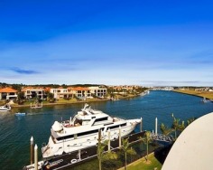 'Sails' is a significant offering of architectural brilliance and grandeur spanning three levels. Distinctly world class, positioned on 5,371sqm with a rare 176 metre wide water frontage, it is set in the prestigious Hope Island Resort.
Approximately 2,709sqm all-occasion living and entertaining
5,371sqm of north facing riverfront land, with private pontoon
Eclectic mix of classic styling and contemporary chic
Swarovski Crystal chandeliers, breathtaking views to the river
Two grand master suites, one encompassing entire upper wing
Five master sized bedrooms with ensuites and walk-in-robes
Superb commercial grade kitchen, office wing with boardroom
Library with fireplace, bar, cinema and a billiards room
Lagoon style pool, wet bar, indoor spa, sauna, barbecue area
Lift, garage for 8 cars, C-Bus, 24 hour security, F.I.R.B approved