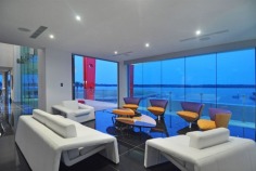 Magnificent is truly an understatement. The epitome of contemporary style and supreme luxury, this superb abode caters for your every need. With over 2,200 square metres of opulent living, the sprawling home is spread over 4 levels. Characterised by floor-to-ceiling glass, superlative black granite tiles, vibrant red features and exquisite furnishings, this mansion is built for living on a grand scale.

Positioned in a premium street in the exclusive Sovereign Islands, this spectacular residence boasts an awesome street presence. On the water side, you will enjoy a protected position in calm water, while looking directly over the Broadwater and out to South Stradbroke Island and Surfers Paradise - a rare and privileged position.

It's features include:

- 60 metres water frontage (approx)
- 18 metre floating pontoon
- 9 metre high entrance foyer with imported chandelier
- 7 massive bedrooms, all ensuited with walk-in robes
- Incredible master suite
- Kids retreat with rumpus lounge, 2 bedrooms and study/storage room
- Separate fully self-contained caretaker's apartment
- 2 executive offices with luxury built-in storage rooms
- Games room with fabulous views
- Media room with built-in bar
- Multiple lounge and dining areas
- Sensational full-size bar
- Stunning temperature-controlled 1500 bottle wine cellar with wine-tasting bar
- Fabulous enormous kitchen with the ultimate in appliances and butler's pantry
- Multiple outdoor entertaining areas
- Full outdoor kitchen and 2 x built-in BBQ's
- Indoor heated pool and separate spa
- Fully equipped gymnasium
- Breathtaking 6000 litre tropical aquarium feature
- Commercial 12-person lift servicing all 4 levels
- Basement garaging for 15 cars
- Manicured gardens
- AMX automation system
- Full concrete construction

Only an inspection can truly reveal the magnificence of this incredible home. Call agent now to arrange your private inspection - confidentiality assured.