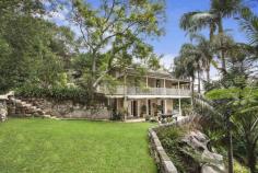  18 Ferdinand Street, Hunters Hill NSW Superb Sandstone Residence Commissioned by Henry Brooks, and built by the Joubert brothers from local sandstone in 1852, "Walshale" is a rare and superb example of Hunters Hill peninsula of yesteryear. Fronting Ferdinand Street Reserve this exquisite property enjoys private northerly views across the Lane Cove River to Linley Point, St Ignatius College and Burns Bay. The home retains exposed internal and external sandstone walls, original ornate ceilings and established gardens that are a major feature of the home with winding sandstone paths and secluded sanctuaries nestled amongst the trees.  The main hallway exudes natural light from the atrium skylights and leads you to the northern end of the home where a large formal lounge and dining room with two fireplaces and French doors open onto a polished timber verandah where the views and ambience are at their finest.  The addition of a master wing with a large bedroom, walk in wardrobe, ensuite and a separate nursery/retreat was carried out in the 1990's and compliments the character of the home. In addition there are 2 bedrooms on the upper level that share a large main bathroom with spa bath and a separate powder room is perfect for visiting guests. Downstairs there is a large open plan living and dining room with working fireplace adjoining a well equipped kitchen with separate pantry. A study/fourth bedroom enjoys its own entrance and French doors again open to a sandstone paved entertainment patio which blends seamlessly into the solar heated swimming pool and upper level lawn area. The expansive lower lawn area has a lockable shed for all of your gardening equipment and gate access to the reserve for launching your kayak and use of a shared council boat shed. A lock up garage accommodates two cars plus work bench and there is additional carport parking for two cars. A large store room or home office is conveniently positioned underneath the garage.  "Walshale" really is a unique property that needs to be seen to be appreciated so be sure not to miss your first opportunity in nearly twenty years to acquire this truly special sandstone home of local significance. 