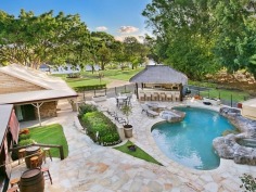 RARE MAIN RIVER ESTATE - An Entertainers Paradise
For the past 18 years has been home to one of Australia's most successful sportsmen.

The main home is Ranch style with 5 large bedrooms, 5 bathrooms, study, gourmet kitchen, large living rooms and double garage. Additional to this, there is a separate guest area including kitchen, lounge, bathroom, large office, work room and 3rd garage.

Bring your friends to the unique freestanding fully equipped sports bar to watch sport with beer on tap. The pool area has its own Bali Hut with full kitchen including Pizza Oven. At your own jetty enjoy the undercover BBQ area. 

This truly amazing property has all the benefits of a resort in your own backyard only 10 minutes to the beach and all the best the Gold Coast has to offer. 

A private estate on Main River where properties rarely become available this estate has everything an entertainer could want.

Countless more features for the discerning buyer of this property to enjoy! This sensational property has to be seen to be believed. Don't miss this opportunity.
View Sold Properties for this Location
View Auction Results
General Features
Property Type:House
Bedrooms:5
Bathrooms:5
Indoor Features
Ensuite:4
Ducted Heating
Ducted Cooling
Air Conditioning
The ...