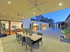CURRENT OWNERS ARE DOWNSIZING
Don't miss out.........take this opportunity to purchase this spectacular family home with space for whole family! The current owners are downsizing, put your best foot forward and inspect now!

Situated on 1067m2, this magnificent family home offers not only a highly sought after address, but a carefree and ultra-contemporary design, focusing on space, privacy and lifestyle. 

The massive open-plan kitchen, living and dining area is a masterpiece and maximises the home's natural, magnetism for light and breeze. Multiple sliding doors connect you to the outdoors and the clever 'U' shape design highlights the stunning entertaining area, sparkling swimming pool and immaculate landscaped gardens. 

The deluxe kitchen is fitted with the most-modern of appliances, including integrated miele dishwasher, stainless steel gas cook top, double AEG stainless steel ovens, huge walk in pantry and expansive stone island bench complete with striking chandeliers that set the mood for an intimate dinner or a bright and festive fare. 

Four of the five mammoth bedrooms have ensuites and all have walk in robes. The master suite having his and hers walk in robes and a spacious hotel style ensuite with stone bench tops, double sinks and spa. 

All five bedrooms are located upstairs, leaving the living and work spaces including a home office and personal gym with access to the swimming pool on the ground level away from the bedrooms.

Close to local shops, universities, transport and some of Brisbane's best schools. Walk to the Queensland Tennis Centre, parklands, bike paths and transport.

Features

- 1067m2 
- Prime location
- Flexible living options
- Huge 3 car lock up garage with storage
- High ceilings
- Polished hard wood floors
- Fully air-conditioned
- Enormous bedrooms
- Media room/games room
- 3 separate living areas
- Built-in stainless steel outdoor kitchen
- Sauna
- Sparkling swimming pool
- Fully fenced private grounds with intercom
- Low maintenance landscaped gardens 
Property Details	
Price $2,195,000	Rates $661.40 per quarter
Total Area 1067 m2