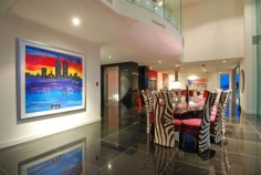 Magnificent is truly an understatement. The epitome of contemporary style and supreme luxury, this superb abode caters for your every need. With over 2,200 square metres of opulent living, the sprawling home is spread over 4 levels. Characterised by floor-to-ceiling glass, superlative black granite tiles, vibrant red features and exquisite furnishings, this mansion is built for living on a grand scale.

Positioned in a premium street in the exclusive Sovereign Islands, this spectacular residence boasts an awesome street presence. On the water side, you will enjoy a protected position in calm water, while looking directly over the Broadwater and out to South Stradbroke Island and Surfers Paradise - a rare and privileged position.

It's features include:

- 60 metres water frontage (approx)
- 18 metre floating pontoon
- 9 metre high entrance foyer with imported chandelier
- 7 massive bedrooms, all ensuited with walk-in robes
- Incredible master suite
- Kids retreat with rumpus lounge, 2 bedrooms and study/storage room
- Separate fully self-contained caretaker's apartment
- 2 executive offices with luxury built-in storage rooms
- Games room with fabulous views
- Media room with built-in bar
- Multiple lounge and dining areas
- Sensational full-size bar
- Stunning temperature-controlled 1500 bottle wine cellar with wine-tasting bar
- Fabulous enormous kitchen with the ultimate in appliances and butler's pantry
- Multiple outdoor entertaining areas
- Full outdoor kitchen and 2 x built-in BBQ's
- Indoor heated pool and separate spa
- Fully equipped gymnasium
- Breathtaking 6000 litre tropical aquarium feature
- Commercial 12-person lift servicing all 4 levels
- Basement garaging for 15 cars
- Manicured gardens
- AMX automation system
- Full concrete construction

Only an inspection can truly reveal the magnificence of this incredible home. Call agent now to arrange your private inspection - confidentiality assured.