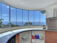 175 Tinderbox Road, Tinderbox TAS Stunning & Exclusive European Styled Haven Welcome to private, sublime and prestigious living. This home has a dazzling 180 degree water view which sets the scene for the majestic spit level, high ceilinged, open plan spectacular that is your new living space. Purposely built by the owner this property is of superior quality and truly a marvel that needs to be inspected to be fully appreciated. Sitting on 5 acres this 330m2 approx (including garage) home offer a plethora of benefits and extras but let's start with the basics. The open plan kitchen is a work of art with skilfully hand crafted timber fixtures and high quality appliances, with a back drop of stunning water views it is in fact an envious creative space to cook up a feast. Behold 4 beautifully styled bedrooms; the master suite (on top level) has exceptional water views, private balcony, ensuite with double shower, double vanity and full sized spa. In all there are 3 bathrooms in this gorgeous abode, 2 residing off the main living area as well as a study. Off the sizable dining area is a sun catching semicircle domed, fully glassed conservatory which leads to a fully fenced backyard.  This home also boasts floor heating which can be used in individual rooms or the whole area, you choose. Other features include a very large separate laundry/utility room, wine cellar (in the basement area), tiled double garage with internal access, additional multiple parking spots on concreted driveway and several various established fruit trees. In close proximity to schools, beaches, shopping conveniences and services. If you are exploring properties in this price range please do not miss the opportunity to inspect this exciting, luxurious and visually rich home. House Size: 300 sqm (approx) Land Size: 20730 sqm (Approx)   Property Snapshot   Property Type: House Construction: Brick Features: Ensuite 