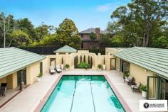 22 Sydney Road,  East Lindfield NSW For Sale - Expressions Of Interest  5  6  4 Set on a sprawling estate (4,232m2) this magnificent Art Deco residence is one of the largest land holdings in the Lower North Shore. Showcasing elegantly preserved interiors and a scale of awe-inspiring grandeur, 'Meadow Lea' is a timeless offering with historical title deeds. Accessed via a circular driveway, the home (1200m2 internal) showcases a grand entry foyer, with soaring ceilings and a magnificent spiral staircase. Built in 1941, the home is superb in design, built around a stunning swimming pool. A full-size tennis court with pavilion, home gym and a thermostatically controlled wine cellar that can hold 2500 bottles add to the homes opulence. On entry level is a new state-of-the-art kitchen with walk-in-pantry and Caesarstone benches, with a formal dining room with exquisite chandelier ideal for entertaining guests. Also on this level is a ballroom with bar, currently configured as a media room. A mix of formal and relaxed living areas make up the remainder of the level. Retreat to the accommodations on the second level where the generously proportioned master wing features a private balcony, dressing room, fireplace and ensuite. Three additional bedrooms on this level share a bathroom, with balconies on both sides of the home looking across the magnificent grounds. Surrounded by restored sandstone walls, the estate offers complete privacy, with a video intercom for added security. Beautifully landscaped, the homes meticulously manicured lawns are ideal for marquee-style entertaining.  With such expansive grounds on offer, the property also presents potential for further development of the site, with DA approval for a separate house (1162sqm) on the estate.  Boasting a range of lavish features for modern living, the residence also offers a triple car garage, separate single garage and charming original fireplaces. Positioned on a corner block, the impressive estate is located close to a selection of schools and Roseville Golf Club. Contact Travis Reeve on 0414 347 713 to arrange a private appointment. 