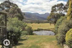  1864 Huon highway, grove tas CALMNESS UNREPEATED FOR SALE - $420,000+ If you are longing for a life of rural calm & a tranquil existence then this beautiful free flowing cottage style house is for you. With magnificent views of the iconic Mountain Sleeping Beauty from your warm and light lounge & dining or through the French doors of your elegant main bedroom room it is hard not to be whisked away to your happy place. There are rare places like this that just make you feel better when you enter them & this home has done that for the owners for 20 years now. The views aren't limited to this Mountain as in the foreground & within the boundaries of the 1.6 acres of well maintained gardens is your very own dam where the ducks happily exist & add to the beauty. Picture yourself sitting on the park bench whilst watching the children exploring with delight & collecting the eggs from your very own chickens. All of this is within an easy 25 minute commute to Hobart. The home has been lovingly restored, maintained & improved to what you see today. The main bedroom has a walk in robe and ensuite with access to a lovely deck through french doors; the 2nd & 3rd bedrooms are double in size with one of these having access to a private paved courtyard. There are 2 living areas to separate the family who can't decide on which channel they wish to view & all the areas have been freshly carpeted. The newly renovated kitchen is spacious & functional with Silas stone bench tops, an impressive & large Belling gas cook top/oven, large walk in pantry, glass splash back, and durable bamboo floating floor. This home has many surprises that have been cleverly added to benefit the function & feel. It has a sunroom currently being used as an art studio at the end of the wrap around undercover deck, surprise!! It has a fully self contained chalet that comes to you furnished & ready for friends, relatives or the teenager who wants to retreat, surprise!! It is heated by a clever wood fired ducted heating system that is kept under the home and is sure to impress the energy conscious & frugal buyer, surprise!! It has a 2 car garage & workshop for the handyman of the family to have their space, surprise!! If that wasn't enough it has a field of Ixia flowers that pop up to reveal a garden of beauty and colour every September, surprise!! There are more fruit trees than I can mention & a large vegetable patch that offers self sufficiency. But it is definitely best that you see this rural delight that is unrepeated to this extreme anywhere else in this area. PROPERTY OVERVIEWProperty ID:3P1647Property Type:HouseLand Size:6084m² approx.Building Size:166m²Garage:2Car Space:4 