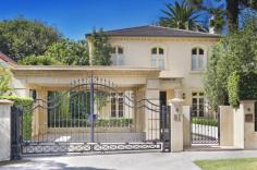  Magnificent European-inspired residence 81 Balfour Road , BELLEVUE HILL Auction Reminiscent of a classically inspired European estate, this impressive residence showcases grand proportions, meticulously selected finishes and a seamless transition between the indoors and the breathtaking alfresco areas. Completed in 2007, it's set on a level 802 sqm parcel of land in one of the East's premier blue ribbon enclaves, just a brief walk to the Rose Bay waterfront. The two-storey home contains five bedrooms and 4.5 bathrooms, including a lavish master suite with a travertine ensuite, custom-designed dressing room and a Juliet balcony. Both the elegant formal lounge and dining room and stately office are warmed by gas fires. Encompassing a sleek CaesarStone Miele kitchen, the casual entertaining space opens to an expansive terrace complete with an in-built barbeque and automated awnings. It overlooks impeccably manicured gardens with sculpted hedges, towering palm trees, a gas-heated heated pool, putting green and a poolside cabana/gym with a WC and fridges. 