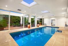 HAMPTON 28 Beach Road
EmailFacebookTwitterGoogle +Print this pageAdd to Favourite/BookmarkShare this site
Private Sale Contact Agent
4 B 3 b 4 C Watch property video
Unparalleled Resort Style Living on the Bay!
Enjoy a luxury beachside lifestyle with show-stopping bay views and timeless Jon Friedrich design with a focus on exceptional indoor/outdoor entertaining. Inspired by Noosa's Seahaven Resort this prestigious 3 bedroom, 3.5 bathroom residence boasts spectacular uninterrupted views stretching from Sandringham Yacht Club to Green point & beyond combined with sparkling internal pool views downstairs. Immaculately presented for family enjoyment featuring grand proportions and three flexible living zones including a ground floor kids haven or guest quarters with two double bedrooms both with mirrored robes & sleek granite vanity ensuites and a fully fitted study that provides a fourth bedroom option. Choose a dip in the Bay via direct access to one of Melbourne's best beaches or luxuriate by the tranquil indoor resort style lap pool encased in huge glass windows with sliding doors to a vast family lounge & bar on one side and a landscaped, paved outdoor area on the other. Panoramic views dominate the upstairs open plan living & dining area with an epicurean kitchen (granite bench tops & walk in pantry) and a sublime full-length outdoor terrace perfect for sunset entertaining. An elegant parents lounge with study alcove & a rear sun soaked deck (built in BBQ) precedes a lavish master suite with 'his & hers' dressing room and a grand Travertine spa ensuite. Meticulous attention to detail, superior finishes and luxury extras such as custom cabinetry throughout, a poolside shower, zoned heating/A/C, ducted vacuuming, alarm and a unique circular driveway with two internal access double garages (4 cars) only moments to Hampton Street shopping, dining & the station complete this idyllic family residence. For more information about this unsurpassed lifestyle property please contact Andrew Campbell.