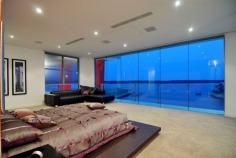 Magnificent is truly an understatement. The epitome of contemporary style and supreme luxury, this superb abode caters for your every need. With over 2,200 square metres of opulent living, the sprawling home is spread over 4 levels. Characterised by floor-to-ceiling glass, superlative black granite tiles, vibrant red features and exquisite furnishings, this mansion is built for living on a grand scale.

Positioned in a premium street in the exclusive Sovereign Islands, this spectacular residence boasts an awesome street presence. On the water side, you will enjoy a protected position in calm water, while looking directly over the Broadwater and out to South Stradbroke Island and Surfers Paradise - a rare and privileged position.

It's features include:

- 60 metres water frontage (approx)
- 18 metre floating pontoon
- 9 metre high entrance foyer with imported chandelier
- 7 massive bedrooms, all ensuited with walk-in robes
- Incredible master suite
- Kids retreat with rumpus lounge, 2 bedrooms and study/storage room
- Separate fully self-contained caretaker's apartment
- 2 executive offices with luxury built-in storage rooms
- Games room with fabulous views
- Media room with built-in bar
- Multiple lounge and dining areas
- Sensational full-size bar
- Stunning temperature-controlled 1500 bottle wine cellar with wine-tasting bar
- Fabulous enormous kitchen with the ultimate in appliances and butler's pantry
- Multiple outdoor entertaining areas
- Full outdoor kitchen and 2 x built-in BBQ's
- Indoor heated pool and separate spa
- Fully equipped gymnasium
- Breathtaking 6000 litre tropical aquarium feature
- Commercial 12-person lift servicing all 4 levels
- Basement garaging for 15 cars
- Manicured gardens
- AMX automation system
- Full concrete construction

Only an inspection can truly reveal the magnificence of this incredible home. Call agent now to arrange your private inspection - confidentiality assured.