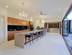 CURRENT OWNERS ARE DOWNSIZING
Don't miss out.........take this opportunity to purchase this spectacular family home with space for whole family! The current owners are downsizing, put your best foot forward and inspect now!

Situated on 1067m2, this magnificent family home offers not only a highly sought after address, but a carefree and ultra-contemporary design, focusing on space, privacy and lifestyle. 

The massive open-plan kitchen, living and dining area is a masterpiece and maximises the home's natural, magnetism for light and breeze. Multiple sliding doors connect you to the outdoors and the clever 'U' shape design highlights the stunning entertaining area, sparkling swimming pool and immaculate landscaped gardens. 

The deluxe kitchen is fitted with the most-modern of appliances, including integrated miele dishwasher, stainless steel gas cook top, double AEG stainless steel ovens, huge walk in pantry and expansive stone island bench complete with striking chandeliers that set the mood for an intimate dinner or a bright and festive fare. 

Four of the five mammoth bedrooms have ensuites and all have walk in robes. The master suite having his and hers walk in robes and a spacious hotel style ensuite with stone bench tops, double sinks and spa. 

All five bedrooms are located upstairs, leaving the living and work spaces including a home office and personal gym with access to the swimming pool on the ground level away from the bedrooms.

Close to local shops, universities, transport and some of Brisbane's best schools. Walk to the Queensland Tennis Centre, parklands, bike paths and transport.

Features

- 1067m2 
- Prime location
- Flexible living options
- Huge 3 car lock up garage with storage
- High ceilings
- Polished hard wood floors
- Fully air-conditioned
- Enormous bedrooms
- Media room/games room
- 3 separate living areas
- Built-in stainless steel outdoor kitchen
- Sauna
- Sparkling swimming pool
- Fully fenced private grounds with intercom
- Low maintenance landscaped gardens 
Property Details	
Price $2,195,000	Rates $661.40 per quarter
Total Area 1067 m2