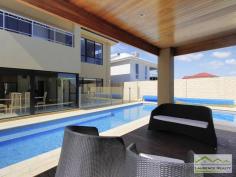  6 Lautoka Rise, Mindarie WA Beaumonde homes have been built on reputation since 1986 and this stunning 2008 built home is a classic example of the style, quality of craftsmanship and attention to detail that Beaumonde demand.  The owners of this gorgeous home insisted on important facets of the build to ensure their home exuded sophistication and quality like 38 and 37 course ceilings, imported Italian porcelain tiles, pewter granite, Eastern Blackbutt flooring from Grandwood floors and Daiken Reverse Cycle Ducted Air conditioning.  Not only is this home a stunning/quality built property but it is located in a very desirable position only minutes walk to the Mindarie Marina, Claytons beach the schools and shops. Gorgeous ocean views greet you as soon as you walk upstairs with the bright blue sparkle of the pool below.  This home is faultless, see the list of features below:  Level One:  Inviting generous decked porch area with double door entry  Classic beautiful lobby bringing you into the formal lounge  Formal Lounge the perfect place to great your guests  Double Doors lead to the open Family/Dining/Kitchen-the most important and most used area of the home with recess area to family room for the TV, a bank of glass surrounding the dining area.  Huge kitchen with Pewter granite bench tops that have shark nosed edging, massive walk in pantry, central island work area giving you uninterrupted views of the swimming pool, quality under bench oven and gas hot plate with overhead stainless steel and glass range hood. Appliance cupboard and good sized fridge recess plus plenty of preparation area  Leading from the hub of the home you enter the purpose built Theatre Room with dual access to the outdoors so can be a multi-purpose room great as a big play room when the children are small  Three very generous children?s bedrooms all with double robes and of course those 38 course ceilings  Main Bathroom has a separate WC with powder room which then leads to the main shower and the oval bath  Walk in Linen giving plenty of storage  Well equipped laundry Level Two:  Beautiful elegant staircase leading to the top level  Huge open space consisting of the Study and the upstairs Lounge  Kitchenette/Bar upstairs with glass splashback, fridge, microwave and sink  Massive balcony with beautiful ocean views  Main Bedroom Suite with private balcony thru double doors  Massive walk in robe  Amazing En suite with double basin vanity, huge oval spa bath, generous shower and separate WC Extras you will enjoy:  Outdoor Cabana with decking and timber lined ceiling that overlooks the pool  Stand Alone bricked Shed ? ideal to convert into shower block  Ducted Reverse Cycle Air conditioning  Solid timber flooring and Italian porcelain tiling  Warm timber double front doors  Storage under the Stairs  Huge double garage with sectional remote door  Quality light fittings and down lights  Wrap around below ground swimming pool with water feature  Extensive limestone paving surrounding the home  Grassed area for the kids to play  Side access thru timber gates  Completed in 2008  Approximate size of home in total 380sqm  Block size 612sqm 