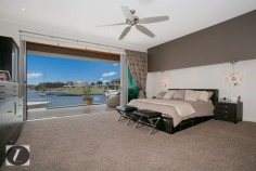 Modern contemporary elegance would best describe this stunning three-level home, perfectly positioned on the waterfront overlooking the wide open canal and out to the Broadwater. From the striking water feature in the entry, through to the incredible kitchen with backlit glass feature, this home provides the very best in indoor and outdoor luxury lifestyle. Whether you are after an impressive bar and entertaining area on the waterfront, or a huge man cave including 12 person spa, this is the house for you!

This home's features include:

-	6 bedrooms
-	5 bathrooms
-	3 powder rooms
-	10 car basement garage
-	North-to-water aspect
-	28 m* waterfrontage
-	Great floor plan with void creating abundance of light and space
-	Stone, marble and water features provide a warm ambience
-	Floor to ceiling glass bi-folds create the ultimate in seamless indoor/outdoor living
-	Sunken formal lounge with gas fireplace
-	Floor to ceiling glass creates spectacular frame for the sensational water views
-	Open plan living areas taking full advantage of the views
-	Fabulous kitchen with backlit glass feature, stone bench tops, wine fridge, Miele appliances including coffee machine
-	Stunning outdoor entertaining area with electronic shutters, stone benches, bar area, cold room, wine fridges, sink and BBQ - and a big screen TV!
-	Another open air entertaining terrace on the waterfront, next to the in ground heated lap pool with plunge pool
-	Tiered theatre with premier home theatre system, a bar and its own powder room
-	Impressive master suite on ground floor with stone feature wall above the vanities, enormous stand-alone bath
-	Master also boasts large walk-in robe with shoe and handbag display areas
-	Upstairs the 2 large waterfront bedrooms are ensuited with superb views
-	There are also 3 bedrooms built especially for the kids with built-in daybeds, which share a bathroom
-	Enviable 'man-cave' in basement, with sliding doors, plenty of room to create the perfect den for your needs
-	Just outside the den area is a 12-person spa
-	Also in basement you will find a dedicated gym room with TV and floor-to-ceiling mirrors, beauty room and bathroom
-	Schindler's lift to all levels
-	Polished timber floors upstairs
-	Floating pontoon with 15m* pontoon
-	Superb position in canal with views out to the open Broadwater
-	Fully fenced with secure gatehouse at front
-	Fully automated C-bus system
-	Reverse cycle ducted air conditioning

Located in a quiet cul-de-sac in a prestigious street surrounded by other waterfront mansions, you are in good company! The Sovereign Islands is a unique island community providing 24 hour security with patrols. Private, luxurious and secure, yet so close the cafes, restaurants, shops and parklands of Paradise Point.

Call Shaun today to arrange your private inspection.