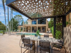 This prestigious estate is situated at the end of the highly respected Maryland Avenue. Situated in privacy behind grand electric gates and sand stone walls are two prime acres on two titles.

The architect has designed this home to maximize its North facing position with views to the East as well. This park like setting with mature trees is elevated 1.7 meters above adjoining land and has not been affected by major floods. This recently refurbished residence offers 1,000 square meters of opulent decor with the latest sinks, tubs and tap ware. Separate from the main house and situated near the entry gates is 2 bedroom guest house with its own complete kitchen, laundry, lounge and study. A large pontoon and wharf beside the river gives access to the Broadwater and out to the ocean from your back yard.

Features of this property:

7 Bedrooms, 6 bathrooms, 5 car garage with parking for upto 10 vehicles
Master bedroom includes parents retreat, twin dressing room, riverside balcony, and deluxe ensuite
Designer chefs kitchen with granite bench tops, 2 oven plus warming ovens, and walk in pantry
A Helipad has been approved for this estate.
Championship tennis court with flood lights and pavilion with kitchen, bath and shower.
10 meter pontoon, jet ski cradle, power and water supply
Infar-red security cameras with back to base alarms
Automatic emergency power generator
fully automated irrigation
Future sub- division potential - subject to council approval
Formal living area with open fireplace
Wine cellar
indoor/outdoor entertaining
In-ground swimming pool
in home theatre with elevated seating and soundproof walls
Games room
sizable laundry
Ducted air-conditioning
Landscaped gardens with mature trees and lush lawns, Horses are permitted on the property
Sweeping 200 degree river and skyline views
Less than 5 minutes drive to Royal Pines Golf Resort, Emerald lakes golf, Lakelands golf
8 min drive to Major Shopping Centres, Schools and Central Business district
This property is currently on two titles with an option to purchase the main house and guest house on 1 acre, or purchase 1 acre of riverfront land for offers over $2 million