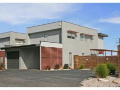 1/42 Oakdowns Parade, Oakdowns TAS You can not surpass the sophistication of this generous family townhouse. Craftsman built with a size to please and a design to cater for flexible living options - this home is ideal for the growing family. Combining a blend of contemporary flair and style with features such as:  ? polished concrete flooring ? quality carpets and window furnishings  ? feature lighting ? well appointed kitchen and bathrooms All this is complemented by a modern colour scheme, chosen by interior designer Loretta Carbray. The versatile floor plan of the home allows for large/combined family options - and showcases uninterrupted views over Ralphs bay to Mt Wellington. All bedrooms are generous in size and offer built-in robes. Two of the bedrooms have three piece ensuites and walk-in robes - one of these bedrooms is located on the main level, which provides the perfect place for a parents or teenagers retreat, or alternatively could be used as a television or recreation room. The four other bedrooms are on the upper level, along with the main bathroom. Providing a practical work area, the kitchen is complete with stainless steel appliances, pantry and breakfast bar. The open plan living is extended via large sliding doors to an entertainment deck for alfresco dining. Flawlessly integrated with its surrounds, the gardens are of a good size being 497sqm (approx.), low maintenance and private. An automated single garage, along with carport complete this home. A superb lifestyle property for the whole family to enjoy. Current rental return $410.00 per week. Internal images are from unit 2 and to be used as a guide only. 