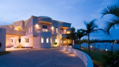 "Sails" is the epitome of luxury, light and space. Set on a waterfront estate of 5,371m2 in the secure Hope Island Resort, this mega-mansion provides flawless standards of luxury. The home boasts vast living spaces, and offers the ultimate in comfort and splendour, with every detail meticulously taken care of.

The four-level residence is the ultimate in visual appeal, displaying architectural brilliance at it's best. Soaring ceilings and incredible water views take your breath away at every turn. Yet with all of it's stunning and lavish features, this is a residence that provides practical living and splendid seclusion. 

-	5,371m2 grounds with 176 metres of water frontage
-	2709m2 approx living space
-	Deep water mooring
-	Six separate living areas
-	Magnificent dedicated dining room
-	Superb commercial-grade kitchen
-	Two grand master suites
-	Five double bedrooms, all ensuited
-	Fully-self-contained penthouse on top level
-	Ten seat fully-equipped tiered theatre
-	Office suite with boardroom
-	Swarovski crystal chandeliers throughout
-	Outdoor entertaining areas including sweeping terraces and custom-built Bali hut

No FIRB approval is required for overseas buyers.

Only an inspection can truly reveal what this palatial home has to offer. View the online video to get a glimpse into this wondrous abode (click on online or virtual tour to view).