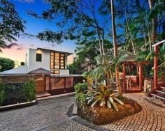 ‘Villa Gabrielle’ graces an address reserved for a privileged few with three architect designed levels embracing sweeping ocean views to Mount Warning. This property has a series of customised living and entertaining spaces and is footsteps to the beach.
Glass doors open to reveal the best views in Byron Bay
Double height foyer has an aquarium and Italian marble floor
Split level dining area and Miele equipped designer kitchen
Lounge features blackbutt floors with a red mahogany border
Tropical gardens reveal a stone water cascade and log gazebo
Black tiled 12m swimming pool with a Japanese stone wall
Double bedrooms pair with deluxe, bespoke feature bathrooms
Master enjoys a level of luxury and a sea view bath ensuite
Vast 734sqm block with lane access and stairs to beach
Near conservation area and minutes to the heart of Byron Bay