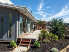 23 Calverton Place, South Arm TAS Sun gathering special Situated in a cul-de-sac position, in a new house area at the friendly seaside town of South Arm, renown for its community lifestyle and amidst the beautiful environment of beaches and walking trails with some of the oldest history in Australia to visit and admire. This sun gathering modern home is ideally placed with mountain views and a level land area of 1847m2. Parking is easy as besides a carport and double garage, there is ample space for the boat or campervans etc. A close and easy walk to the pharmacy, coffee shop, licensed restaurant, hair salon, hobby shop, newsagency post office and general store, RSL golf course/tavern complex and the Metro bus service to Hobart. This property has 2 large bedrooms on the ground level, one with a walk-in-robe and direct access to the bathroom, a separate toilet and laundry. If you are worried about the stairs to the 3rd bedroom with an en-suite, just keep that one for your visitors retreat, however if you wish, it is a beautiful master bedroom.  Under the stairs is a lovely study computer area. The living room is fantastic, running the full length of the house with access out onto the large sundeck. The kitchen with its breakfast island bench is central with a woodheater ideally positioned. A rear sundeck is terrific for those leisurely morning breakfasts, plus the property has delightful gardens, fruit trees and raised garden vegetable beds with a storage shed close by. A very well presented and cared for home in a great position. 