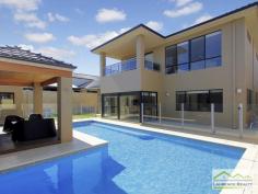  6 Lautoka Rise, Mindarie WA Beaumonde homes have been built on reputation since 1986 and this stunning 2008 built home is a classic example of the style, quality of craftsmanship and attention to detail that Beaumonde demand.  The owners of this gorgeous home insisted on important facets of the build to ensure their home exuded sophistication and quality like 38 and 37 course ceilings, imported Italian porcelain tiles, pewter granite, Eastern Blackbutt flooring from Grandwood floors and Daiken Reverse Cycle Ducted Air conditioning.  Not only is this home a stunning/quality built property but it is located in a very desirable position only minutes walk to the Mindarie Marina, Claytons beach the schools and shops. Gorgeous ocean views greet you as soon as you walk upstairs with the bright blue sparkle of the pool below.  This home is faultless, see the list of features below:  Level One:  Inviting generous decked porch area with double door entry  Classic beautiful lobby bringing you into the formal lounge  Formal Lounge the perfect place to great your guests  Double Doors lead to the open Family/Dining/Kitchen-the most important and most used area of the home with recess area to family room for the TV, a bank of glass surrounding the dining area.  Huge kitchen with Pewter granite bench tops that have shark nosed edging, massive walk in pantry, central island work area giving you uninterrupted views of the swimming pool, quality under bench oven and gas hot plate with overhead stainless steel and glass range hood. Appliance cupboard and good sized fridge recess plus plenty of preparation area  Leading from the hub of the home you enter the purpose built Theatre Room with dual access to the outdoors so can be a multi-purpose room great as a big play room when the children are small  Three very generous children?s bedrooms all with double robes and of course those 38 course ceilings  Main Bathroom has a separate WC with powder room which then leads to the main shower and the oval bath  Walk in Linen giving plenty of storage  Well equipped laundry Level Two:  Beautiful elegant staircase leading to the top level  Huge open space consisting of the Study and the upstairs Lounge  Kitchenette/Bar upstairs with glass splashback, fridge, microwave and sink  Massive balcony with beautiful ocean views  Main Bedroom Suite with private balcony thru double doors  Massive walk in robe  Amazing En suite with double basin vanity, huge oval spa bath, generous shower and separate WC Extras you will enjoy:  Outdoor Cabana with decking and timber lined ceiling that overlooks the pool  Stand Alone bricked Shed ? ideal to convert into shower block  Ducted Reverse Cycle Air conditioning  Solid timber flooring and Italian porcelain tiling  Warm timber double front doors  Storage under the Stairs  Huge double garage with sectional remote door  Quality light fittings and down lights  Wrap around below ground swimming pool with water feature  Extensive limestone paving surrounding the home  Grassed area for the kids to play  Side access thru timber gates  Completed in 2008  Approximate size of home in total 380sqm  Block size 612sqm 