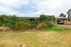  12 Howlett Ramble, ARGYLE WA Hobby Farm in Great Spot! Offers Over $480,000 If you've looked for an affordable 4 bed, 2 bath on 2.02ha (5ac) within a 30mins drive from Bunbury but can't find anything? Well you have arrived at last as this pretty property is privately located at the Donnybrook end of Howlett Ramble. Whisper quiet with only local traffic, the property is well fenced (ring locked) with 4 paddocks currently operating as a hobby farm. A windmill services the animals and yard and a 90,000 litre water tank supplies rainwater to the house. A few fruit trees and some well placed native trees ensure shade in the right areas and privacy and windbreaks. Neither hilly, flat or rocky, it's about perfect! The double brick and iron home enjoys a sunlight filled north facing aspect. The living area and kitchen open onto a huge gabled patio on the north side, which overlooks the rear of the property. There is a separate lounge and the bedrooms are double sized with built-in robes. The kitchen has a walk-in pantry, double sink, electric wall oven and gas cook top with room for an extra large fridge or two. Hot water is instant gas, as is home heating. There are two 3m x 3m garden sheds, 90,000 litre tank, small stable (designed for miniature ponies), irrigated veggie garden area and a carport to house up to 4 vehicles. Make the move out of town and enjoy peace of mind. The kids can roam and hop on one of the local school buses. Consider it now before it's too late! [-]  Property Features Built-In WardrobesClose To SchoolsClose To ShopsClose To TransportFireplace(s)Formal LoungeGarden 