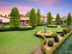 Dural NSWStory Of A Fairy Tale A beautiful blend of timeless charm and modern styling is this magnificent double bricked home set on 1.43 (approx.) desirable landscaped hectares. Every direction you turn there is something amazing to see from water features to amazing gardens to the detail of the architectural design of the home.  Upon entering the driveway through the wrought iron electric gates you will immediately feel as though you have stepped into a fairy tale! You will love the impressive grand entrance with marble floors, huge crystal chandeliers and sublimely crafted centre piece. The style and features of this property cannot be expressed purely in words. However, here is a taste of what this magnificent estate comprises of:  * Elegant formal lounge room with fireplace expanding to the sunken formal dining room  * Gourmet timber kitchen equipped with Miele appliances, granite bench-tops, dishwasher, 3 ovens, microwave and an island bench with a selection of cooking elements  * Huge walk-in pantry leading to the cool room  * Meals area off kitchen  * Family room with fireplace  * Casino dubbed room off family room  * Ballroom with bar, stage, commercial grade kitchen fit for a chef plus a billiard room - Perfect to host your own Great Gatsby party!  * Additional lounge room with pitched wooden panel ceiling, sink and French doors opening to the yard  * Master bedroom with walk-in robe, ensuite and it's own courtyard  * Ensuite to the other 4 bedrooms in the main house  * Resort style bathroom with spa, dual sink, shower and toilet room  * Guest wash closets  * Cancel your gym membership as it includes a gymnasium room and sauna  * Extra living room with laundry tub to the right wing  * The guest house features a lounge & dining room, kitchen with dishwasher, 2 bedrooms and bathroom with separate toilet  * 2 entertainment areas overlooking the pool and BBQ area  * Alluring salt water inground pool with spa, waterfall and it's own island surrounded by palm trees and plants  * Hold your own grand slam with this full size tennis court  * Lots of grass area - perfect for playing croquet or equestrian  * 22x12m shed/mechanic workshop with stable  * 6-car automatic garage  Additional features include: imported Italian wallpaper, ducted air conditioning throughout, alarm system, intercom, security camera system, detailed cornices, high ceilings, feature skylights, French doors & windows, huge laundry, study room, 35,000L underground water tank, septic tank, timers to the external lights and fountains.  Turn your dream into a reality!  For a full list of inclusions and to arrange a private inspection, call Ruma Mundi today on 0411 030 202 or 02 8883 1088. 