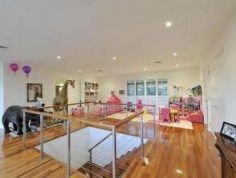 CURRENT OWNERS ARE DOWNSIZING
Don't miss out.........take this opportunity to purchase this spectacular family home with space for whole family! The current owners are downsizing, put your best foot forward and inspect now!

Situated on 1067m2, this magnificent family home offers not only a highly sought after address, but a carefree and ultra-contemporary design, focusing on space, privacy and lifestyle. 

The massive open-plan kitchen, living and dining area is a masterpiece and maximises the home's natural, magnetism for light and breeze. Multiple sliding doors connect you to the outdoors and the clever 'U' shape design highlights the stunning entertaining area, sparkling swimming pool and immaculate landscaped gardens. 

The deluxe kitchen is fitted with the most-modern of appliances, including integrated miele dishwasher, stainless steel gas cook top, double AEG stainless steel ovens, huge walk in pantry and expansive stone island bench complete with striking chandeliers that set the mood for an intimate dinner or a bright and festive fare. 

Four of the five mammoth bedrooms have ensuites and all have walk in robes. The master suite having his and hers walk in robes and a spacious hotel style ensuite with stone bench tops, double sinks and spa. 

All five bedrooms are located upstairs, leaving the living and work spaces including a home office and personal gym with access to the swimming pool on the ground level away from the bedrooms.

Close to local shops, universities, transport and some of Brisbane's best schools. Walk to the Queensland Tennis Centre, parklands, bike paths and transport.

Features

- 1067m2 
- Prime location
- Flexible living options
- Huge 3 car lock up garage with storage
- High ceilings
- Polished hard wood floors
- Fully air-conditioned
- Enormous bedrooms
- Media room/games room
- 3 separate living areas
- Built-in stainless steel outdoor kitchen
- Sauna
- Sparkling swimming pool
- Fully fenced private grounds with intercom
- Low maintenance landscaped gardens 
Property Details	
Price $2,195,000	Rates $661.40 per quarter
Total Area 1067 m2