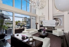 State-of-the-Art Architect designed masterpiece

Overview
Property Type
House
For Sale
$3,600,000
Garage
3
Carport
3
Web ID
2P1115
One of the most extraordinary homes located in an exclusive Gold Coast enclave is this waterfront property inspired by an Australian architect with over 80 squares of indoor/outdoor space showcasing views of the Surfers Paradise & Main Beach skyline , this home represents the best of modern architecture.

The attention to detail is apparent throughout this home with six bedrooms, six bathrooms and separate, New York style guest accommodation there is no denying this home is close to perfect. The expansive main level with its elegant sunken lounge leads onto a fabulous outdoor entertaining area or out by the plunge pool with BBQ area. This property offers numerous centres of activity for the entertainer and growing family alike.

The double storey ceilings give the property an air of immense height and space and with floor to ceiling glass panels allow unlimited views across to the city skyline and canals.

No expense has been spared in the finish of this residence featuring granite and marble floors with exclusive European lighting fixtures complemented by polished timber doors and feature walls. 

The kitchen is a gourmet chef's delight with auto doors and Scandinavian appliances with black marble tops and many features too numerous to mention, There is also a concealed wine cellar for the avid wine buff.

Enjoy lazy days on your own private sandy beach or cool down with a dip in the plunge pool. For the boating enthusiast there is a jetty complete with boat shed and winch. The property comprises three lockup garages and an additional three secure car spaces to cater for visitors.

Beautifully landscaped gardens with imported water features and fishponds offer a perfect backdrop for this property which is nothing short of superlative.

Call for an inspection today to view this extraordinary masterpiece of design and style