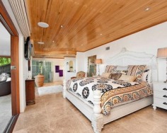 ‘Villa Gabrielle’ graces an address reserved for a privileged few with three architect designed levels embracing sweeping ocean views to Mount Warning. This property has a series of customised living and entertaining spaces and is footsteps to the beach.
Glass doors open to reveal the best views in Byron Bay
Double height foyer has an aquarium and Italian marble floor
Split level dining area and Miele equipped designer kitchen
Lounge features blackbutt floors with a red mahogany border
Tropical gardens reveal a stone water cascade and log gazebo
Black tiled 12m swimming pool with a Japanese stone wall
Double bedrooms pair with deluxe, bespoke feature bathrooms
Master enjoys a level of luxury and a sea view bath ensuite
Vast 734sqm block with lane access and stairs to beach
Near conservation area and minutes to the heart of Byron Bay