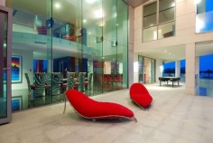 Magnificent is truly an understatement. The epitome of contemporary style and supreme luxury, this superb abode caters for your every need. With over 2,200 square metres of opulent living, the sprawling home is spread over 4 levels. Characterised by floor-to-ceiling glass, superlative black granite tiles, vibrant red features and exquisite furnishings, this mansion is built for living on a grand scale.

Positioned in a premium street in the exclusive Sovereign Islands, this spectacular residence boasts an awesome street presence. On the water side, you will enjoy a protected position in calm water, while looking directly over the Broadwater and out to South Stradbroke Island and Surfers Paradise - a rare and privileged position.

It's features include:

- 60 metres water frontage (approx)
- 18 metre floating pontoon
- 9 metre high entrance foyer with imported chandelier
- 7 massive bedrooms, all ensuited with walk-in robes
- Incredible master suite
- Kids retreat with rumpus lounge, 2 bedrooms and study/storage room
- Separate fully self-contained caretaker's apartment
- 2 executive offices with luxury built-in storage rooms
- Games room with fabulous views
- Media room with built-in bar
- Multiple lounge and dining areas
- Sensational full-size bar
- Stunning temperature-controlled 1500 bottle wine cellar with wine-tasting bar
- Fabulous enormous kitchen with the ultimate in appliances and butler's pantry
- Multiple outdoor entertaining areas
- Full outdoor kitchen and 2 x built-in BBQ's
- Indoor heated pool and separate spa
- Fully equipped gymnasium
- Breathtaking 6000 litre tropical aquarium feature
- Commercial 12-person lift servicing all 4 levels
- Basement garaging for 15 cars
- Manicured gardens
- AMX automation system
- Full concrete construction

Only an inspection can truly reveal the magnificence of this incredible home. Call agent now to arrange your private inspection - confidentiality assured.