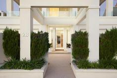 HAMPTON 28 Beach Road
EmailFacebookTwitterGoogle +Print this pageAdd to Favourite/BookmarkShare this site
Private Sale Contact Agent
4 B 3 b 4 C Watch property video
Unparalleled Resort Style Living on the Bay!
Enjoy a luxury beachside lifestyle with show-stopping bay views and timeless Jon Friedrich design with a focus on exceptional indoor/outdoor entertaining. Inspired by Noosa's Seahaven Resort this prestigious 3 bedroom, 3.5 bathroom residence boasts spectacular uninterrupted views stretching from Sandringham Yacht Club to Green point & beyond combined with sparkling internal pool views downstairs. Immaculately presented for family enjoyment featuring grand proportions and three flexible living zones including a ground floor kids haven or guest quarters with two double bedrooms both with mirrored robes & sleek granite vanity ensuites and a fully fitted study that provides a fourth bedroom option. Choose a dip in the Bay via direct access to one of Melbourne's best beaches or luxuriate by the tranquil indoor resort style lap pool encased in huge glass windows with sliding doors to a vast family lounge & bar on one side and a landscaped, paved outdoor area on the other. Panoramic views dominate the upstairs open plan living & dining area with an epicurean kitchen (granite bench tops & walk in pantry) and a sublime full-length outdoor terrace perfect for sunset entertaining. An elegant parents lounge with study alcove & a rear sun soaked deck (built in BBQ) precedes a lavish master suite with 'his & hers' dressing room and a grand Travertine spa ensuite. Meticulous attention to detail, superior finishes and luxury extras such as custom cabinetry throughout, a poolside shower, zoned heating/A/C, ducted vacuuming, alarm and a unique circular driveway with two internal access double garages (4 cars) only moments to Hampton Street shopping, dining & the station complete this idyllic family residence. For more information about this unsurpassed lifestyle property please contact Andrew Campbell.