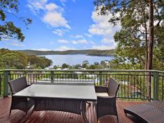 29 Albert Street, Wagstaffe NSW  Set high amongst native bushland, backing onto the Bouddi National Park with breathtaking, north-east facing water views, is this nature lover's retreat. Your stunning views can never be built out from the elevated position that this home provides. Enjoy the sunny north-east aspect from the expansive front deck, with views over the water ways from Killcare to Booker Bay & beyond. Timber floorboards throughout create a natural, rustic charm and the open plan kitchen / living area is flooded with natural light through large windows and sliding doors to the deck. The main bedroom has a walk-in robe, private back balcony and access to the main deck at the front. Downstairs, a large self-contained area provides a 4th bedroom or perfect guest accommodation / home office with separate access. A PJ King inclinator transports you to the upper level and all just a five minute walk to the Wagstaffe store, community hall and the Palm Beach ferry wharf. 