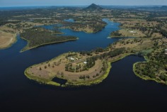 Bimbadeen means place of waterbirds - a waterfront acres sanctuary with 300 degree lake views, fishing, boating, sailing, flying??? Frontage to beautiful Lake Macdonald overlooking Noosa's botanical gardens. Private driveway is boarded by water on either side, with exotic wildlife and magnificent views to Mt Cooroy & Tinbeerwah. The perfect combination of being only 5 minutes from Cooroy and 15 minutes to Noosa, with town water, sewer and peace and tranquility. Sprawling brick residence with raked ceilings, french oak floors, gourmet kitchen, gas & induction cooking and ducted air conditioning. Solid timber doors & windows throughout. 3 separate living areas, wide entertaining patios, 4 car garage and boat store/cellar under the home.
500m Bitumen airstrip, fully insulated 2 plane hangar with workshop, separate machinery shed and van port.
Stroll the park like acreage on this resort style sanctuary tailored for relaxation. Host a tennis party on your own flood lit tennis court. This property is your opportunity to live the dream, own or operate an aircraft, also ideal for car or boat enthusiast with 2 large quality sheds and 3 phase power.18.29 acres/7.4 hectares. For further details or inspection please contact our office. rh06506

Bimbadeen - 18.29 acressealed airstrip2km Lake Frontplane hangar and shedstotally private