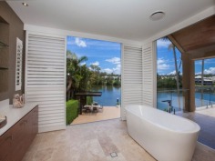 This prestigious estate is situated at the end of the highly respected Maryland Avenue. Situated in privacy behind grand electric gates and sand stone walls are two prime acres on two titles.

The architect has designed this home to maximize its North facing position with views to the East as well. This park like setting with mature trees is elevated 1.7 meters above adjoining land and has not been affected by major floods. This recently refurbished residence offers 1,000 square meters of opulent decor with the latest sinks, tubs and tap ware. Separate from the main house and situated near the entry gates is 2 bedroom guest house with its own complete kitchen, laundry, lounge and study. A large pontoon and wharf beside the river gives access to the Broadwater and out to the ocean from your back yard.

Features of this property:

7 Bedrooms, 6 bathrooms, 5 car garage with parking for upto 10 vehicles
Master bedroom includes parents retreat, twin dressing room, riverside balcony, and deluxe ensuite
Designer chefs kitchen with granite bench tops, 2 oven plus warming ovens, and walk in pantry
A Helipad has been approved for this estate.
Championship tennis court with flood lights and pavilion with kitchen, bath and shower.
10 meter pontoon, jet ski cradle, power and water supply
Infar-red security cameras with back to base alarms
Automatic emergency power generator
fully automated irrigation
Future sub- division potential - subject to council approval
Formal living area with open fireplace
Wine cellar
indoor/outdoor entertaining
In-ground swimming pool
in home theatre with elevated seating and soundproof walls
Games room
sizable laundry
Ducted air-conditioning
Landscaped gardens with mature trees and lush lawns, Horses are permitted on the property
Sweeping 200 degree river and skyline views
Less than 5 minutes drive to Royal Pines Golf Resort, Emerald lakes golf, Lakelands golf
8 min drive to Major Shopping Centres, Schools and Central Business district
This property is currently on two titles with an option to purchase the main house and guest house on 1 acre, or purchase 1 acre of riverfront land for offers over $2 million