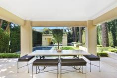  Magnificent European-inspired residence 81 Balfour Road , BELLEVUE HILL Auction Reminiscent of a classically inspired European estate, this impressive residence showcases grand proportions, meticulously selected finishes and a seamless transition between the indoors and the breathtaking alfresco areas. Completed in 2007, it's set on a level 802 sqm parcel of land in one of the East's premier blue ribbon enclaves, just a brief walk to the Rose Bay waterfront. The two-storey home contains five bedrooms and 4.5 bathrooms, including a lavish master suite with a travertine ensuite, custom-designed dressing room and a Juliet balcony. Both the elegant formal lounge and dining room and stately office are warmed by gas fires. Encompassing a sleek CaesarStone Miele kitchen, the casual entertaining space opens to an expansive terrace complete with an in-built barbeque and automated awnings. It overlooks impeccably manicured gardens with sculpted hedges, towering palm trees, a gas-heated heated pool, putting green and a poolside cabana/gym with a WC and fridges. 