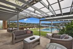 32 Bay Street, Mosman NSW This luxuriously renovated family home boasts panoramic views across Quakers Hat Bay and Middle Harbour and offers a private whisper quiet lifestyle. This property is a rare combination of a family friendly layout, superb entertaining possibilities and world class views. Features include: Stylish renovated interiors, large 915 m2 block, landscaped front & rear gardens Vast living areas flowing to covered entertaining with stunning back drop Child friendly garden/lawn and swimming pool all visible from kitchen & living Gourmet integrated Caesar stone kitchen with 2 bosch ovens Superb master suite with luxurious ensuite, walk in robes, stunning views Hardwood and Travertine floors, stained glass, LED downlights, Ducted air-conditioning  Double automatic garage with internal access, additional storage, alarm Moments to shops, schools, buses and scenic bayside reserves A fabulous home for families of all ages with a spectacular middle harbour backdrop. A must see. 
