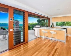 ‘Villa Gabrielle’ graces an address reserved for a privileged few with three architect designed levels embracing sweeping ocean views to Mount Warning. This property has a series of customised living and entertaining spaces and is footsteps to the beach.
Glass doors open to reveal the best views in Byron Bay
Double height foyer has an aquarium and Italian marble floor
Split level dining area and Miele equipped designer kitchen
Lounge features blackbutt floors with a red mahogany border
Tropical gardens reveal a stone water cascade and log gazebo
Black tiled 12m swimming pool with a Japanese stone wall
Double bedrooms pair with deluxe, bespoke feature bathrooms
Master enjoys a level of luxury and a sea view bath ensuite
Vast 734sqm block with lane access and stairs to beach
Near conservation area and minutes to the heart of Byron Bay