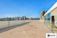 Unit 1501/507 Wattle Street,  Sydney NSW For Sale - $3,300,000  3  4  4 For the first time offered since completion, Vanguarde is happy to present to you this spectacular brand new three bedroom penthouse, which is ideal for the modern family or foreign purchaser. Commanding the top 2 levels, this impressive residence offers a huge roof top terrace with uninterrupted 180 degree north, views of Sydney. Spanning from the west right around to the east, this aspect incorporates stunning city skyline and Anzac Bridge views. Accommodation comprises of 3 generous bedrooms, all with full ensuites including spa bath, and built in robes. This residence offers a total of 545sqm on title. The huge rooftop terrace includes a full outdoor kitchen with BBQ plus a complete guest bathroom. With direct lift access from the ground, making it perfect for entertaining guests! Features include only the highest quality finishes throughout, including marble stone and Australian hardwood timber flooring, LED lights and double glazed floor to ceiling glass, allowing you to take in the expansive views. The designer kitchen comes complete with White Caesar stone bench tops, stainless steel Smeg appliances including built in coffee machine and plate warmer, soft close drawers and a built in double door fridge. The residence provides ducted reverse cycle air-conditioning, spacious 4 car lock up garage with direct lift access plus extra storage, an internal laundry and a self controlled video security system.  With the lowest strata levies in Sydney for a property of this size, and the possibility to extend space and add value, the opportunities in purchasing this property are endless.  This is truly a unique property and is must see for anyone looking at purchasing their perfect city home! Quarterly Rates Strata: $805 per quarter approx Water: $168 per quarter approx Council: $225 per quarter approx For more information contact Travis Reeve on 0414 347 713 or travis@vanguarde.com.au or Darren Smith on 0412 418 415 