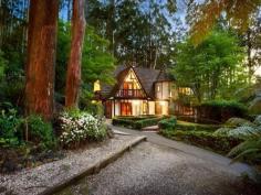 ONE-OF-A-KIND DREAM HOME, EXCLUSIVE SETTING 7 PERRINS CREEK ROAD, OLINDA, VIC 3788 4 2 6 Entertainers paradise  Exclusive privacy and tranquillity  Lush low-maintenance forest setting Set on approximately 1 acre of low-maintenance garden surrounds with another 9 acres of lush private forest offering pure peace and serenity, this much-loved property with widespread parquetry flooring and cable internet offers flexible living over 3 distinct levels. With its gorgeous Tudor architectural style modelled on the best of Western Europe; Feathertop, a hidden gem of a property nestled amongst giant poplars and lush ferns is the ultimate seclusion weekender, fairytale family home or even possible one-of-a-kind B&B while being only 15 minutes away from the Monash Freeway. On the entry level find an expansive living room (with bay window), separate dining and extensive kitchen (boasting Blanco appliances); powder room and private study with built-in mahogany wall units. Decorative Oregon ceiling beams extend throughout. An amazing spiral wooden staircase ascends to a vast master bedroom with ensuite (double shower). 2 further bedrooms and a huge main bathroom with spa bath and double basins can be found under the characteristically steeply pitched roof. All bedrooms include high quality crafted built-in robes and chests of draws and their own private balconies. Additional storage area in the attic completes the 1st floor. The open plan basement provides the perfect opportunity to escape the summer holiday heat. Set up your own theatre or games room, gym and wine cellar. Also discover on this floor a separate laundry, additional powder room and internal access to a 6 car concrete built garage. Perfect for entertaining, your guests who will love to visit this picturesque setting - entertain amongst the treetops in the paved outdoor areas or on the extensive balcony surrounding the first level. If you have ever wanted a fairy tale life or home to be captivated by, Feathertop will make your dreams come true! FOR SALEExpressions Of Interest FEATURES GENERAL FEATURES Property Type:   House Bedrooms:   4 Bathrooms:   2 INDOOR Indoor Spa Built in Wardrobes Dishwasher Air Conditioning OUTDOOR Garage Spaces:   6 OTHER FEATURES Privacy and Tranquillity, Entertaining terraces, Tudor architecture , Parquetry flooring CONTACTS SCOTT BANKS Mobile: 0411 700 099 Email this agent 