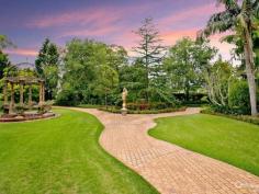 Dural NSWStory Of A Fairy Tale A beautiful blend of timeless charm and modern styling is this magnificent double bricked home set on 1.43 (approx.) desirable landscaped hectares. Every direction you turn there is something amazing to see from water features to amazing gardens to the detail of the architectural design of the home.  Upon entering the driveway through the wrought iron electric gates you will immediately feel as though you have stepped into a fairy tale! You will love the impressive grand entrance with marble floors, huge crystal chandeliers and sublimely crafted centre piece. The style and features of this property cannot be expressed purely in words. However, here is a taste of what this magnificent estate comprises of:  * Elegant formal lounge room with fireplace expanding to the sunken formal dining room  * Gourmet timber kitchen equipped with Miele appliances, granite bench-tops, dishwasher, 3 ovens, microwave and an island bench with a selection of cooking elements  * Huge walk-in pantry leading to the cool room  * Meals area off kitchen  * Family room with fireplace  * Casino dubbed room off family room  * Ballroom with bar, stage, commercial grade kitchen fit for a chef plus a billiard room - Perfect to host your own Great Gatsby party!  * Additional lounge room with pitched wooden panel ceiling, sink and French doors opening to the yard  * Master bedroom with walk-in robe, ensuite and it's own courtyard  * Ensuite to the other 4 bedrooms in the main house  * Resort style bathroom with spa, dual sink, shower and toilet room  * Guest wash closets  * Cancel your gym membership as it includes a gymnasium room and sauna  * Extra living room with laundry tub to the right wing  * The guest house features a lounge & dining room, kitchen with dishwasher, 2 bedrooms and bathroom with separate toilet  * 2 entertainment areas overlooking the pool and BBQ area  * Alluring salt water inground pool with spa, waterfall and it's own island surrounded by palm trees and plants  * Hold your own grand slam with this full size tennis court  * Lots of grass area - perfect for playing croquet or equestrian  * 22x12m shed/mechanic workshop with stable  * 6-car automatic garage  Additional features include: imported Italian wallpaper, ducted air conditioning throughout, alarm system, intercom, security camera system, detailed cornices, high ceilings, feature skylights, French doors & windows, huge laundry, study room, 35,000L underground water tank, septic tank, timers to the external lights and fountains.  Turn your dream into a reality!  For a full list of inclusions and to arrange a private inspection, call Ruma Mundi today on 0411 030 202 or 02 8883 1088. 