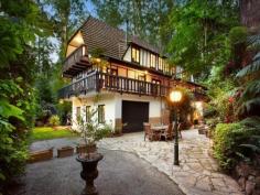 ONE-OF-A-KIND DREAM HOME, EXCLUSIVE SETTING 7 PERRINS CREEK ROAD, OLINDA, VIC 3788 4 2 6 Entertainers paradise  Exclusive privacy and tranquillity  Lush low-maintenance forest setting Set on approximately 1 acre of low-maintenance garden surrounds with another 9 acres of lush private forest offering pure peace and serenity, this much-loved property with widespread parquetry flooring and cable internet offers flexible living over 3 distinct levels. With its gorgeous Tudor architectural style modelled on the best of Western Europe; Feathertop, a hidden gem of a property nestled amongst giant poplars and lush ferns is the ultimate seclusion weekender, fairytale family home or even possible one-of-a-kind B&B while being only 15 minutes away from the Monash Freeway. On the entry level find an expansive living room (with bay window), separate dining and extensive kitchen (boasting Blanco appliances); powder room and private study with built-in mahogany wall units. Decorative Oregon ceiling beams extend throughout. An amazing spiral wooden staircase ascends to a vast master bedroom with ensuite (double shower). 2 further bedrooms and a huge main bathroom with spa bath and double basins can be found under the characteristically steeply pitched roof. All bedrooms include high quality crafted built-in robes and chests of draws and their own private balconies. Additional storage area in the attic completes the 1st floor. The open plan basement provides the perfect opportunity to escape the summer holiday heat. Set up your own theatre or games room, gym and wine cellar. Also discover on this floor a separate laundry, additional powder room and internal access to a 6 car concrete built garage. Perfect for entertaining, your guests who will love to visit this picturesque setting - entertain amongst the treetops in the paved outdoor areas or on the extensive balcony surrounding the first level. If you have ever wanted a fairy tale life or home to be captivated by, Feathertop will make your dreams come true! FOR SALEExpressions Of Interest FEATURES GENERAL FEATURES Property Type:   House Bedrooms:   4 Bathrooms:   2 INDOOR Indoor Spa Built in Wardrobes Dishwasher Air Conditioning OUTDOOR Garage Spaces:   6 OTHER FEATURES Privacy and Tranquillity, Entertaining terraces, Tudor architecture , Parquetry flooring CONTACTS SCOTT BANKS Mobile: 0411 700 099 Email this agent 