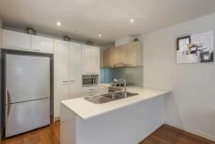  2/881 Doncaster Road, Doncaster East VIC Impeccable & Inviting Presenting the height of style and sophistication, this stunning ground floor apartment sits nestled in a boutique residential complex opposite Jackson Court. Showcasing high quality structure, fixtures and design, and a sleek contemporary aesthetic, it presents a spectacular open floor plan that combines the kitchen, living and dining domain with a private balcony plus 2 bedrooms serviced by 2 bathrooms.  Also features:  *Polished floorboards; SS appliances  *Central bathroom & ensuite; Laundry facilities  *Split system heating & air conditioning  *Secure basement car park & storage space  *Close to buses, schools, parks & sports facilities  *Near to Doncaster Park+Ride, Westfield & Eastern Freeway 